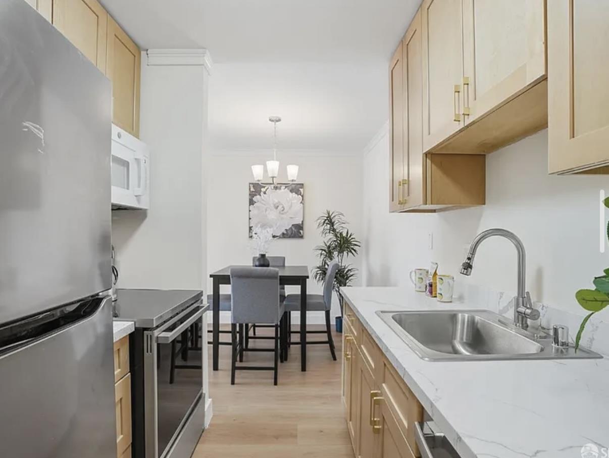 4081 Clayton Road, Unit 235 Concord, CA 94521 - Photo 10 of 19 a kitchen with a table and chairs in it
