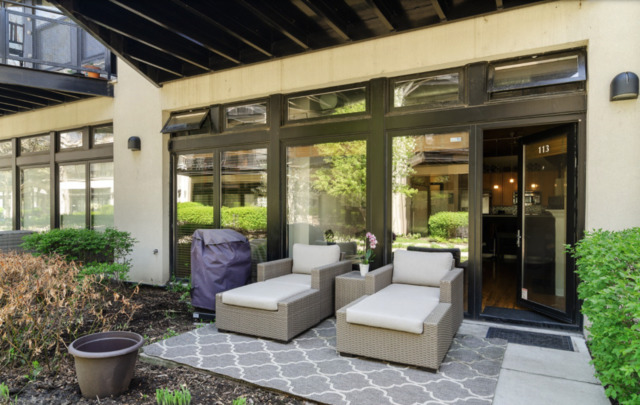 1110 West 15th Street, Unit 113 Chicago, IL 60608 - Photo 11 of 14 a building outdoor space with patio furniture and potted plants