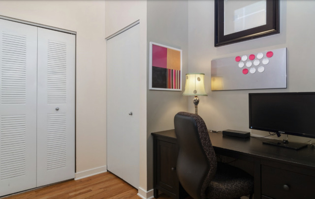 1110 West 15th Street, Unit 113 Chicago, IL 60608 - Photo 10 of 14 a workspace with furniture and wooden floor