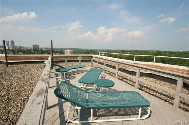 a view of a swimming pool with a terrace