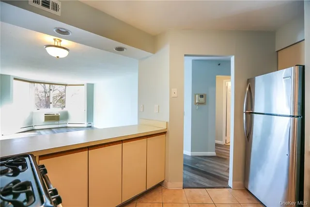 a kitchen with stainless steel appliances a refrigerator and a sink