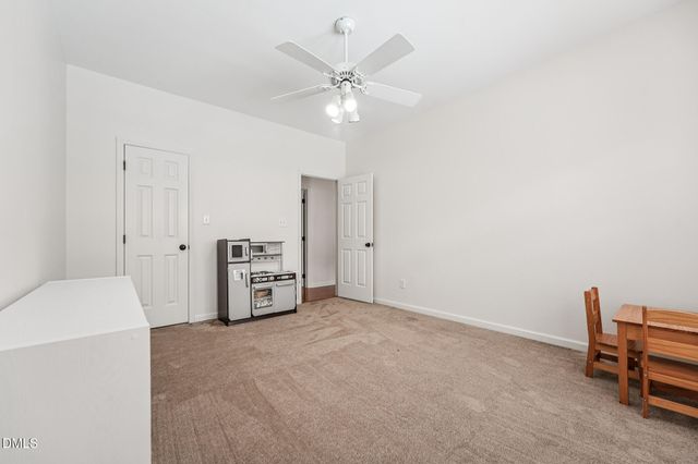 a bathroom with a sink toilet and a mirror