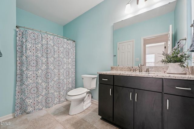 a view of a hallway with windows