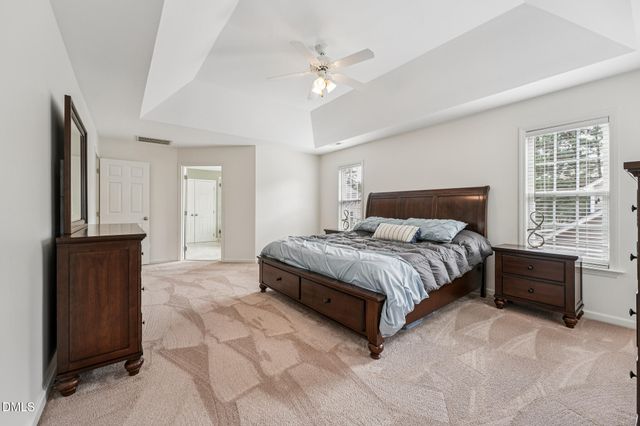 a bathroom with a tub shower and sink