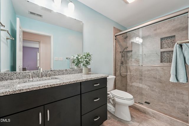 a view of a kitchen with sink and wooden floor