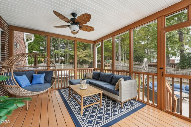 a view of a backyard with a patio and outdoor seating