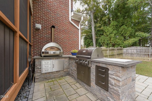 a view of a house with swimming pool and sitting area