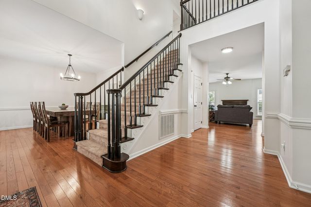 a front view of a house with yard and garage