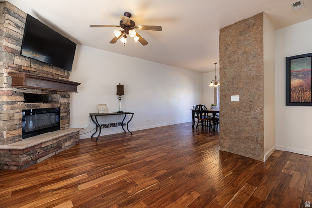 6 300th Road North, Unit I6 Kanab, UT 84741 - Photo 9 of 37 Living area featuring ceiling fan, dark wood finished floors, and a stone fireplace