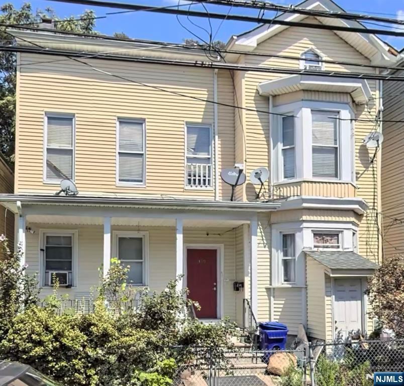 337-379 Ellison Street Paterson, NJ 07501 - Photo 1 of 27 front view of a house