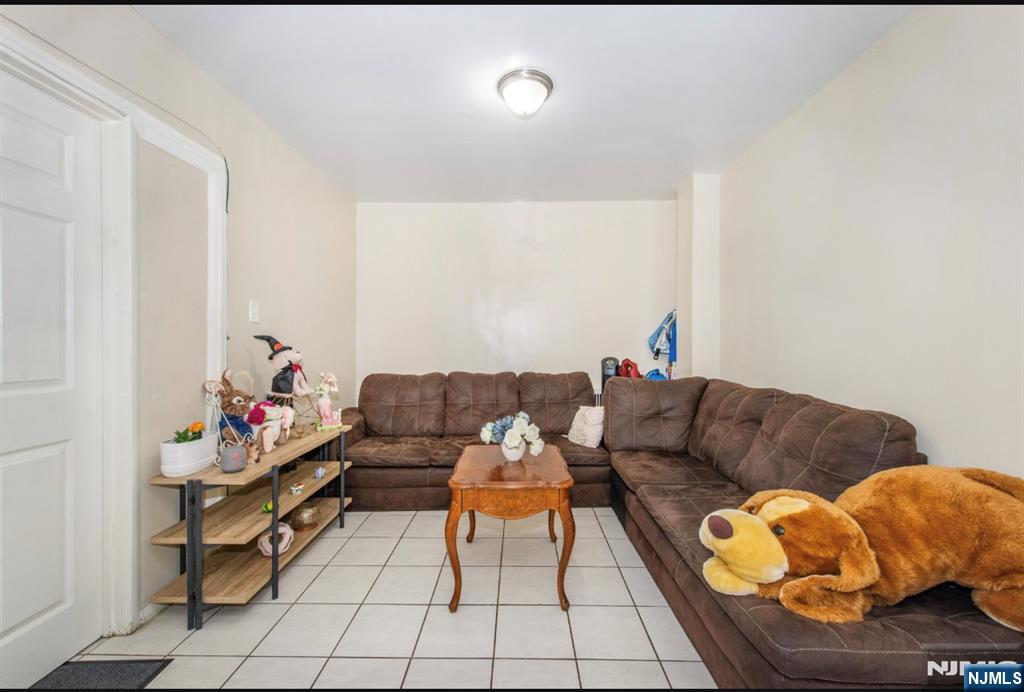 337-379 Ellison Street Paterson, NJ 07501 - Photo 11 of 27 a living room with furniture and a couch