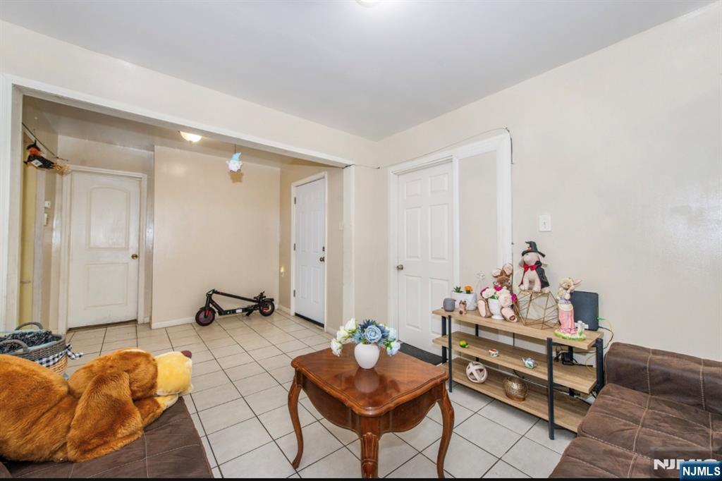 337-379 Ellison Street Paterson, NJ 07501 - Photo 12 of 27 a living room with furniture and a wooden floor