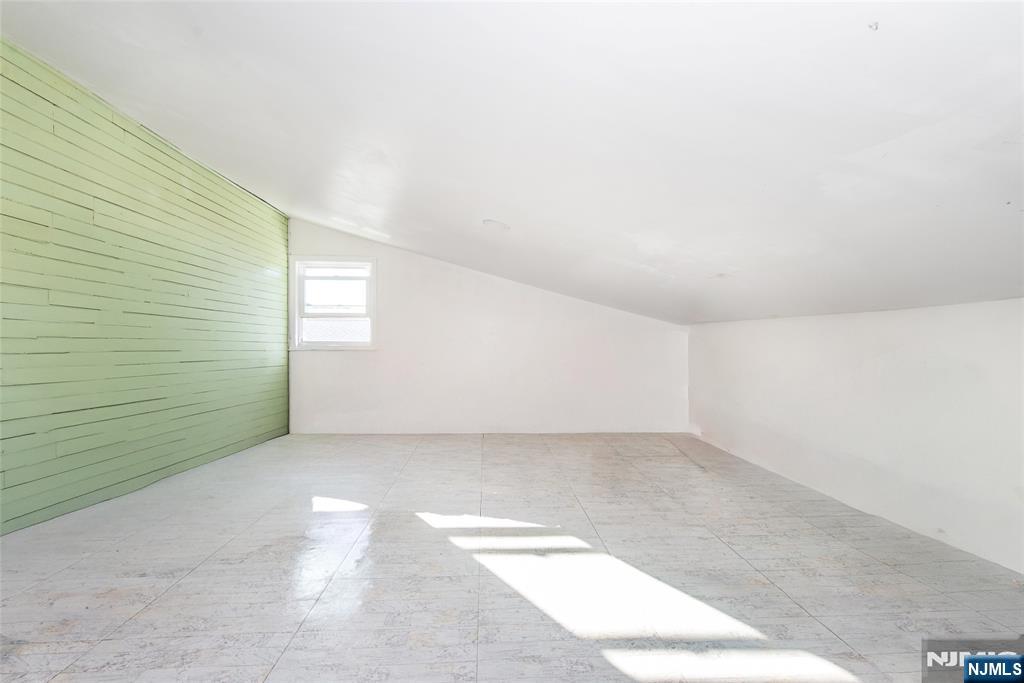 337-379 Ellison Street Paterson, NJ 07501 - Photo 2 of 27 an empty room with windows