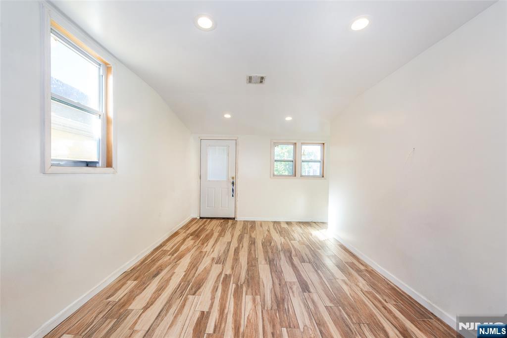 337-379 Ellison Street Paterson, NJ 07501 - Photo 3 of 27 a view of an empty room and window