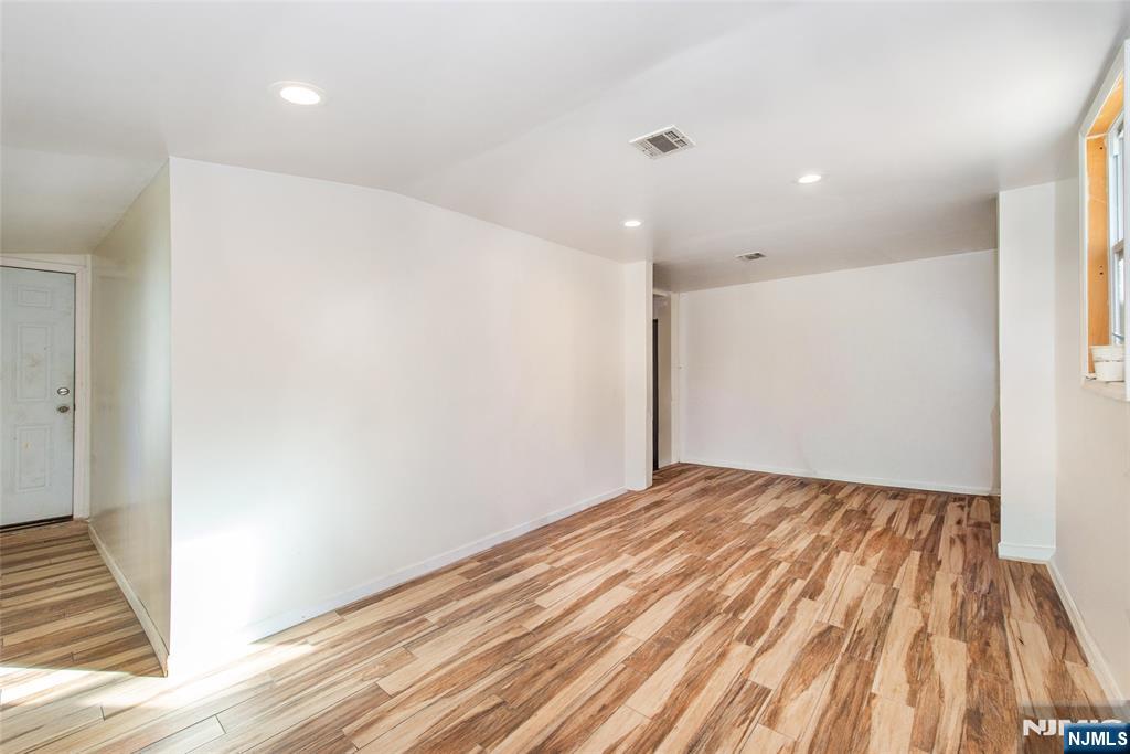 337-379 Ellison Street Paterson, NJ 07501 - Photo 4 of 27 a view of empty room with wooden floor