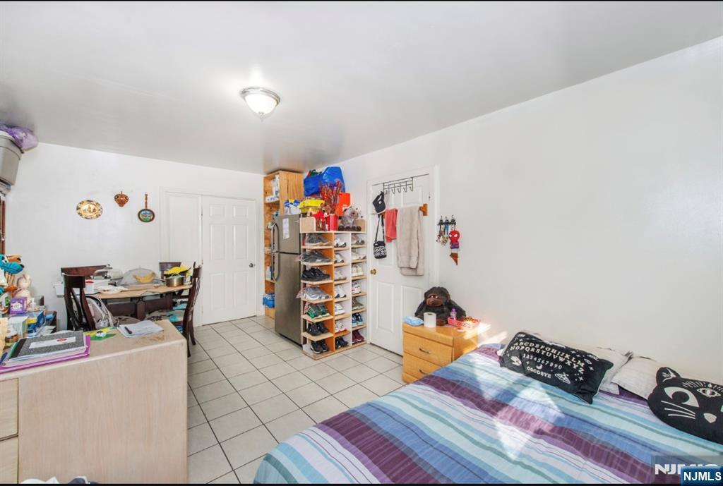 337-379 Ellison Street Paterson, NJ 07501 - Photo 9 of 27 a bedroom with furniture and a bed