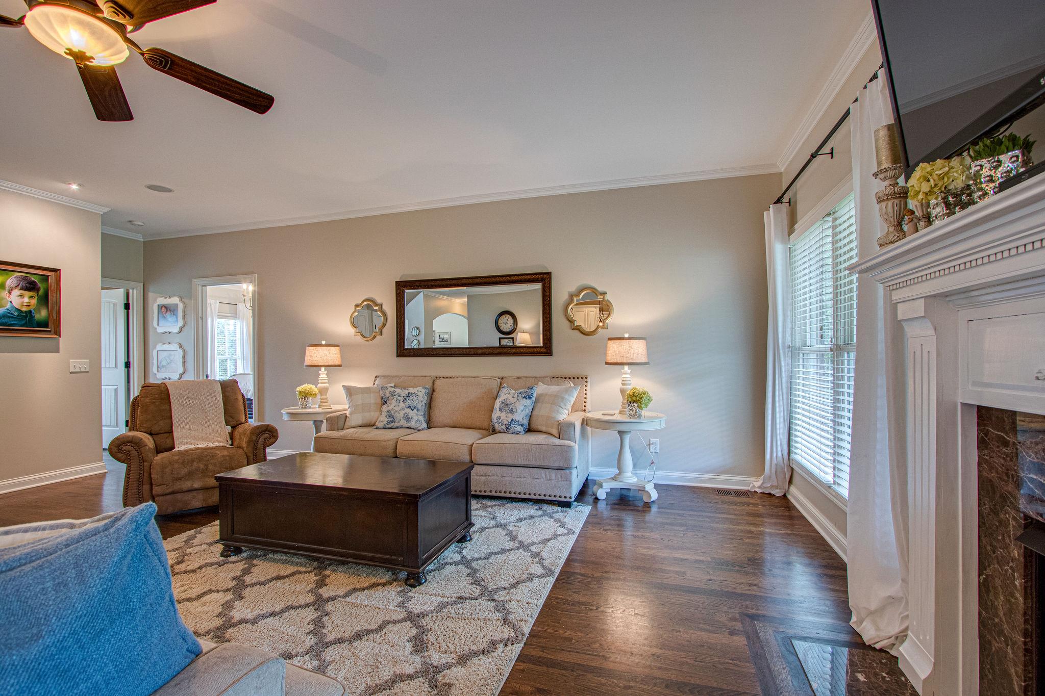 4996 Charles Dorris Road Springfield, TN 37172 - Photo 8 of 29 a living room with furniture and a fireplace