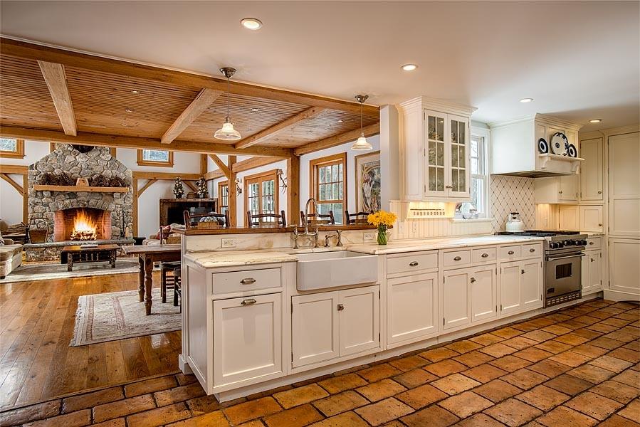 82 Parish Road New Canaan, CT 06840 - Photo 11 of 22 a kitchen with cabinets appliances and a counter space