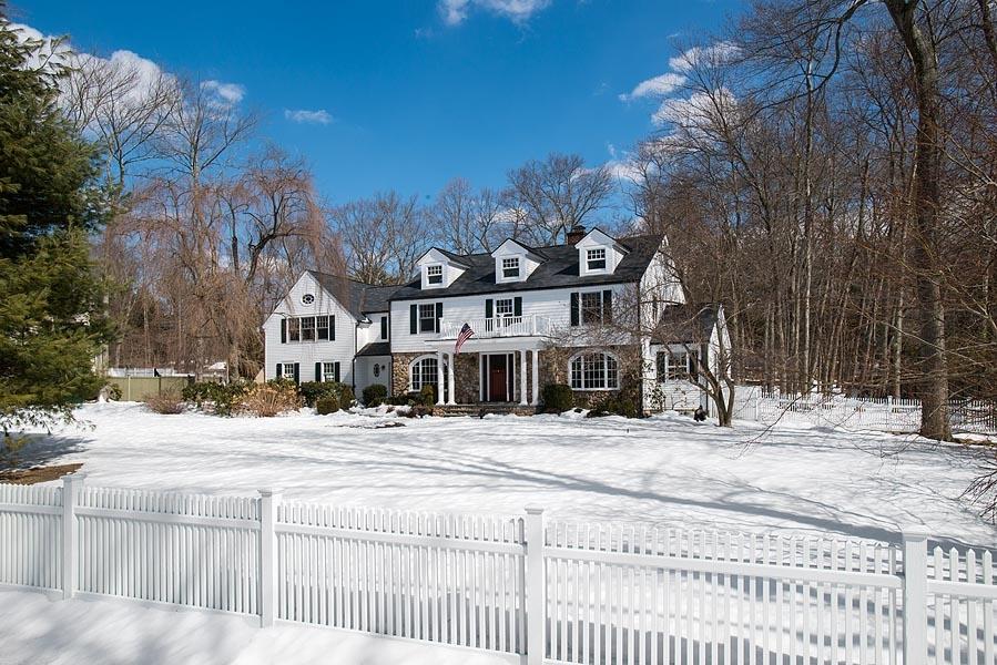 82 Parish Road New Canaan, CT 06840 - Photo 22 of 22 a front view of a house with a yard