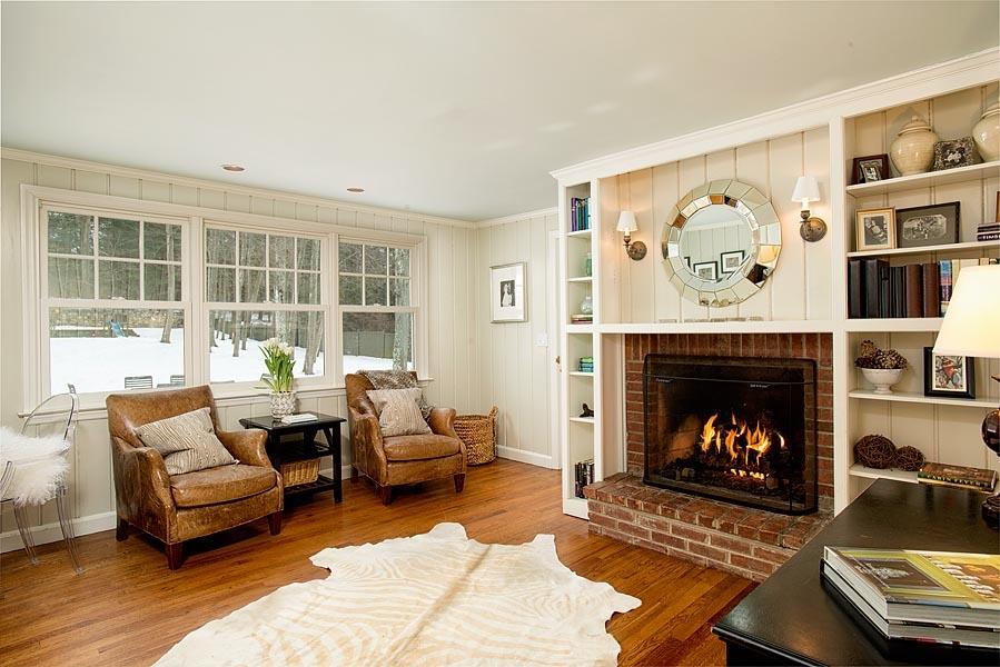 82 Parish Road New Canaan, CT 06840 - Photo 8 of 22 a living room with furniture and a fireplace