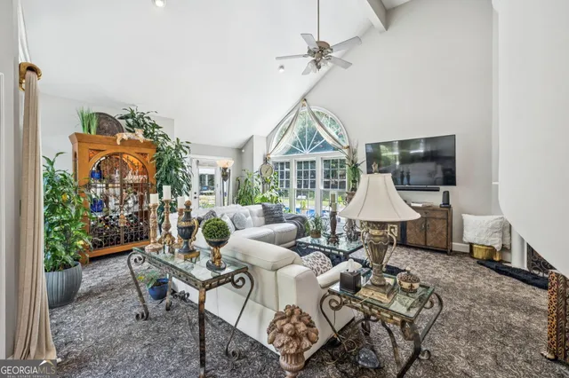 a kitchen with granite countertop a refrigerator and a sink