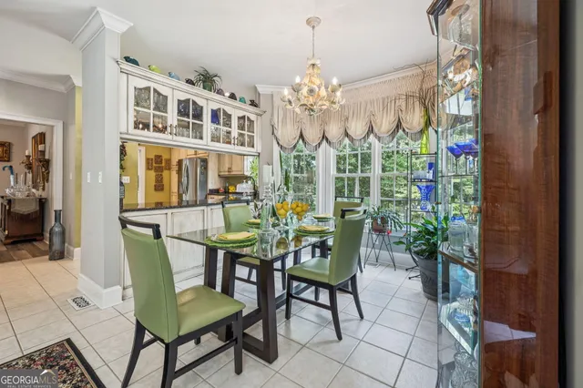 a spacious bathroom with a double vanity sink and a mirror