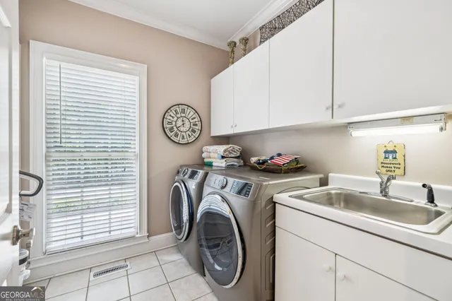a white toilet sitting next to a bathroom and a sink