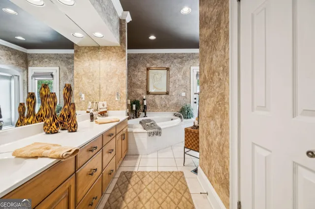 a room with furniture pool table flat screen tv and a chandelier