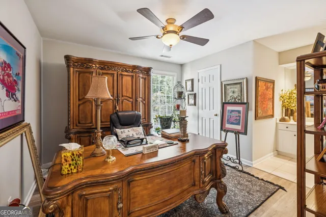 a view of a patio with a table chairs and a potted plant