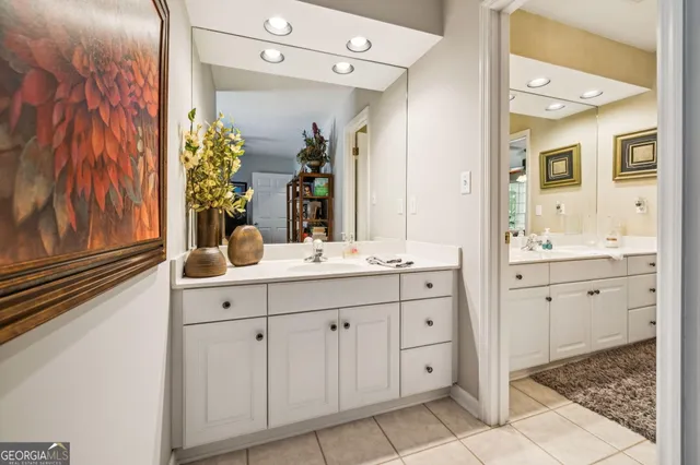 a view of a patio with couches table and chairs and potted plants