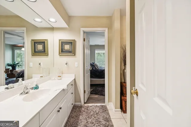 a view of a patio with couches table and chairs and potted plants