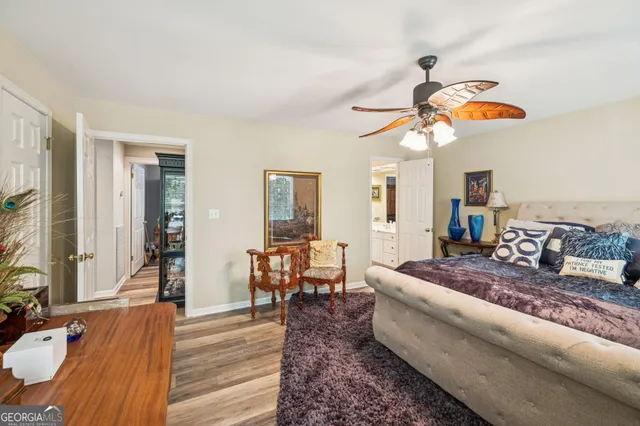 an aerial view of a house with a yard and trees