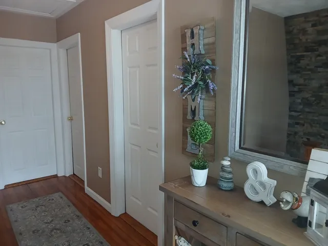 a view of a livingroom with furniture and entryway