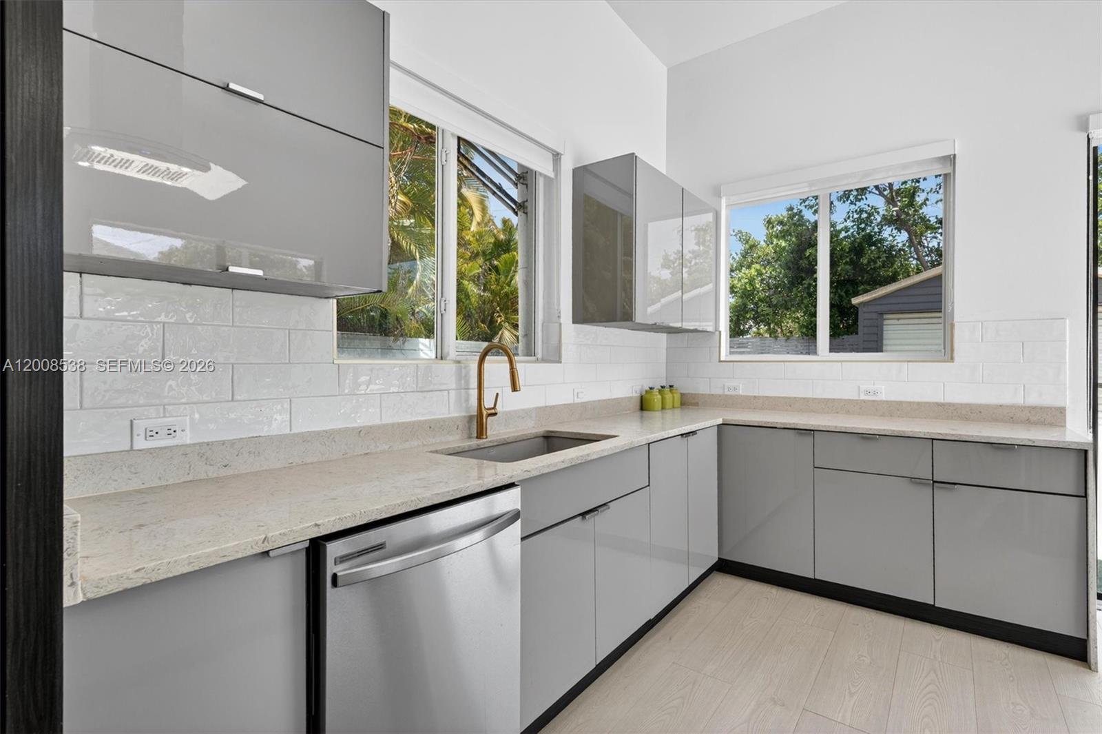 11811 Southwest 82nd Road Miami, FL 33156 - Photo 13 of 63 a kitchen with a sink and large window