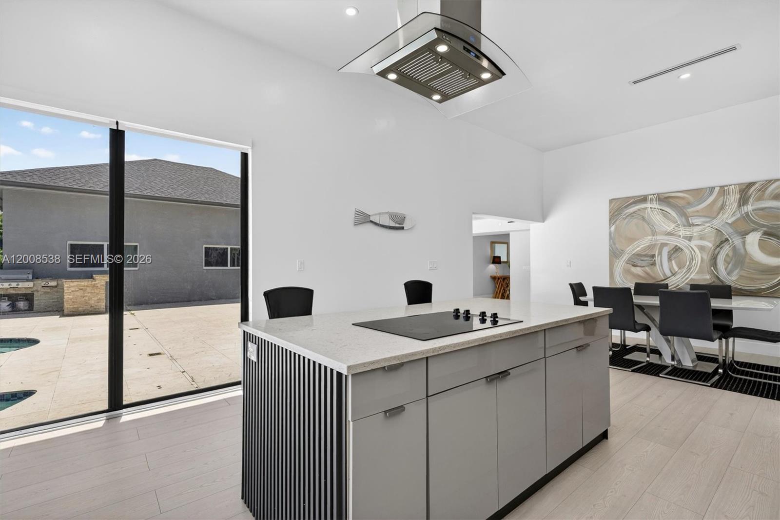 11811 Southwest 82nd Road Miami, FL 33156 - Photo 14 of 63 a room with a sink a counter and gym equipment