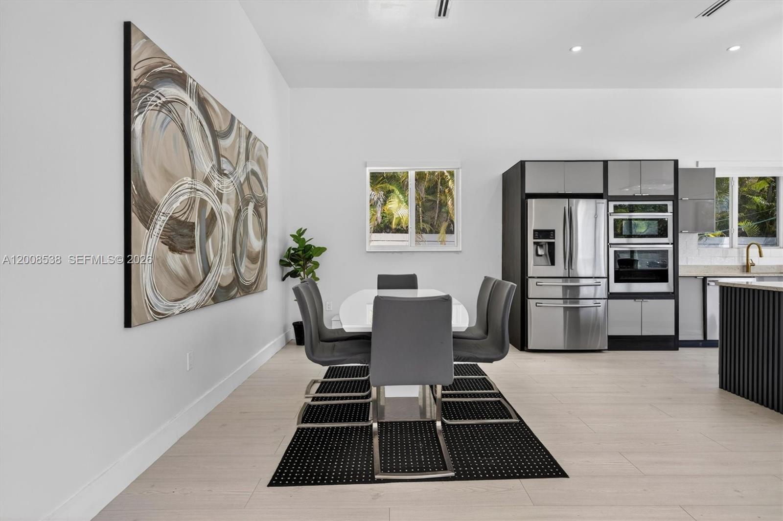 11811 Southwest 82nd Road Miami, FL 33156 - Photo 20 of 63 a kitchen with stainless steel appliances a stove a microwave and a refrigerator
