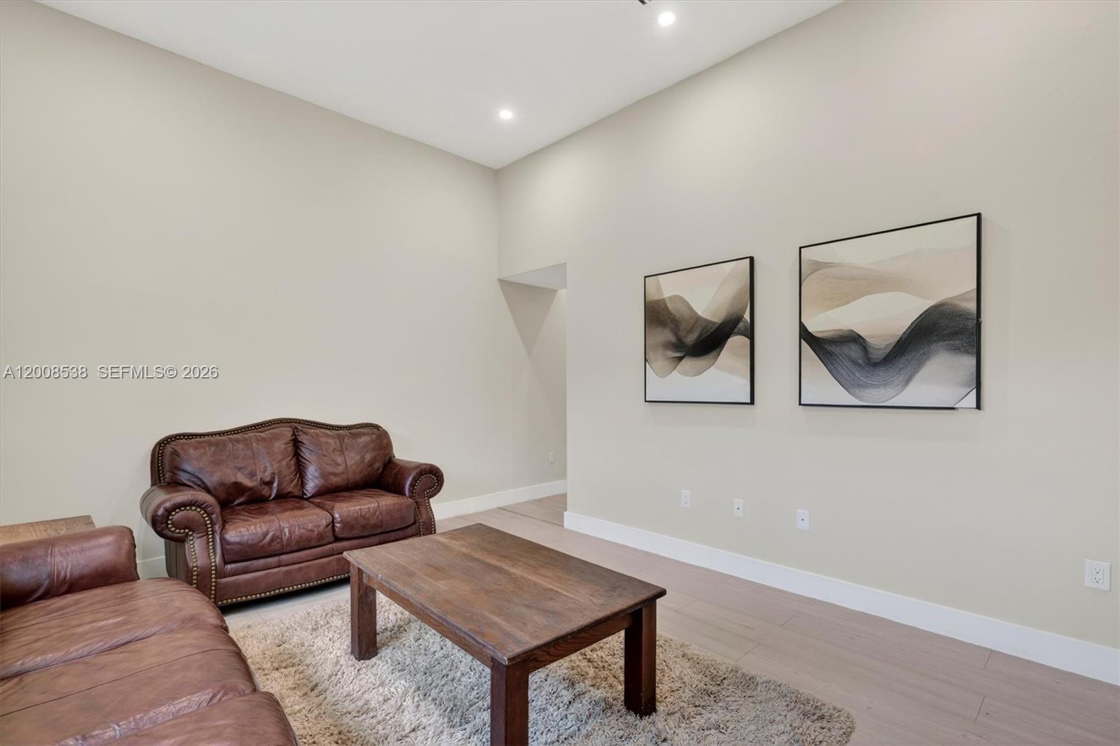 11811 Southwest 82nd Road Miami, FL 33156 - Photo 23 of 63 a living room with furniture and a rug