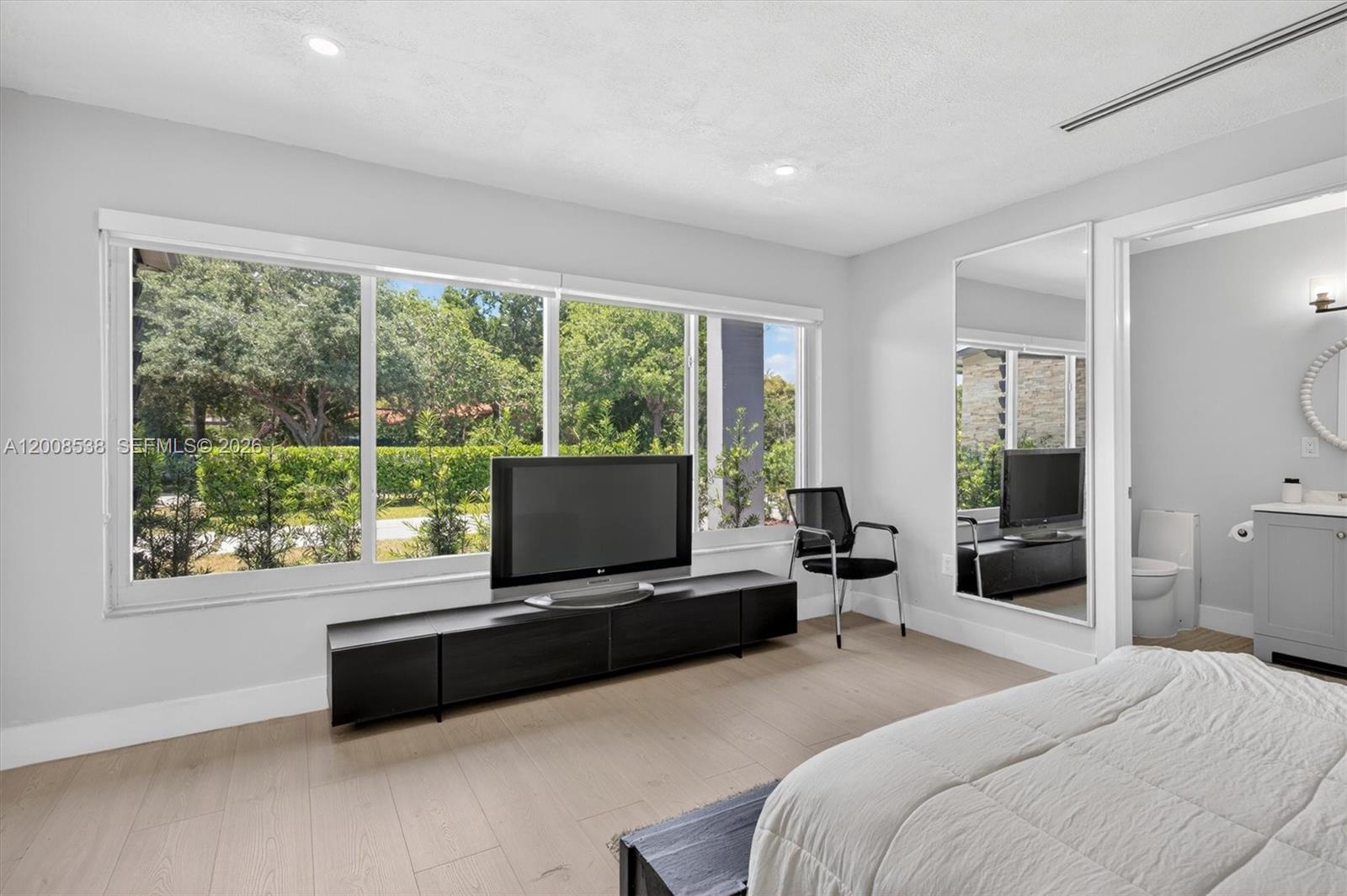 11811 Southwest 82nd Road Miami, FL 33156 - Photo 27 of 63 a bedroom with furniture and windows