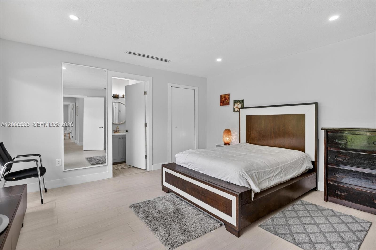 11811 Southwest 82nd Road Miami, FL 33156 - Photo 29 of 63 a bedroom with a bed and a walk in closet