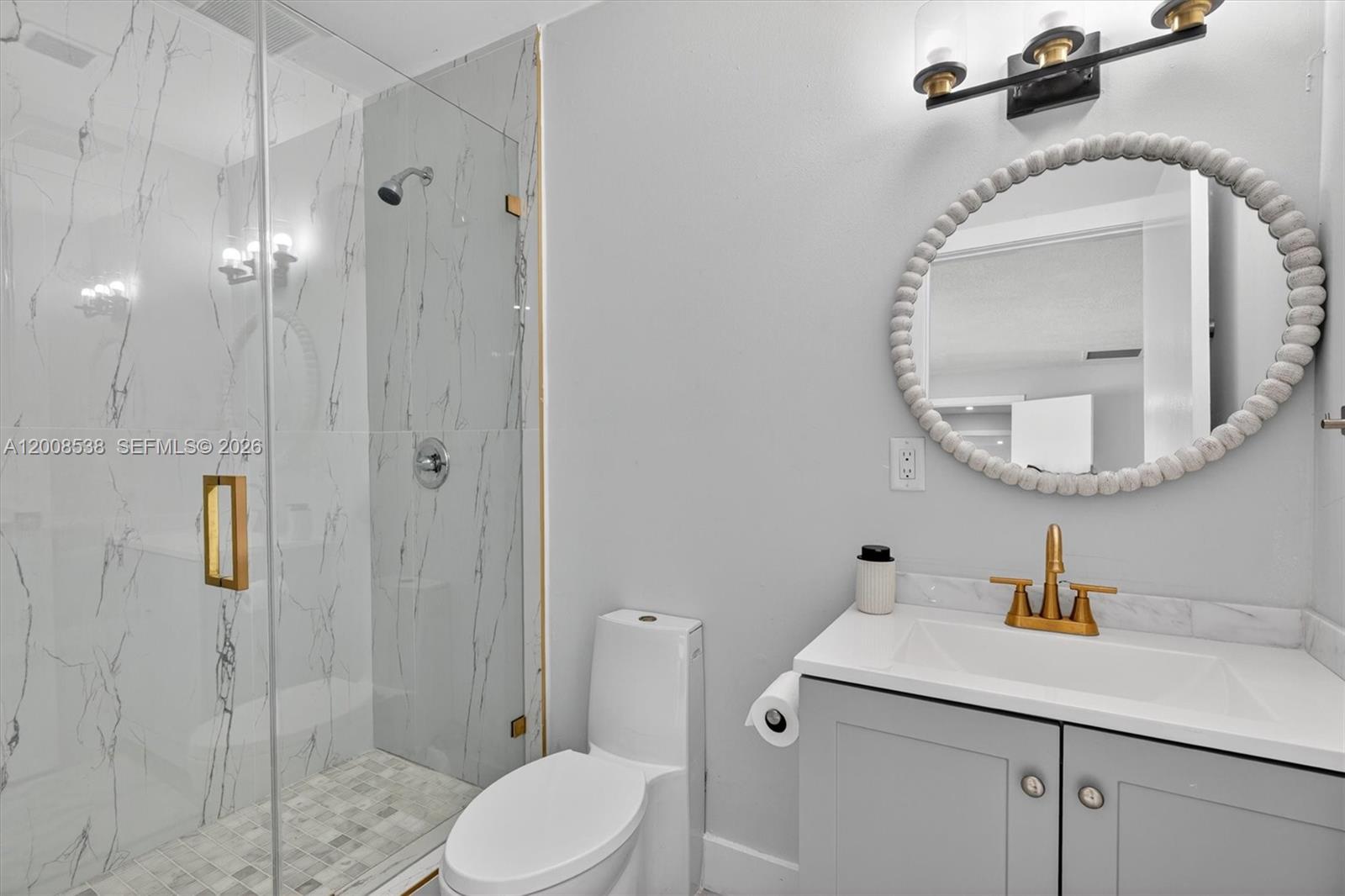 11811 Southwest 82nd Road Miami, FL 33156 - Photo 30 of 63 a bathroom with a toilet sink vanity granite and shower
