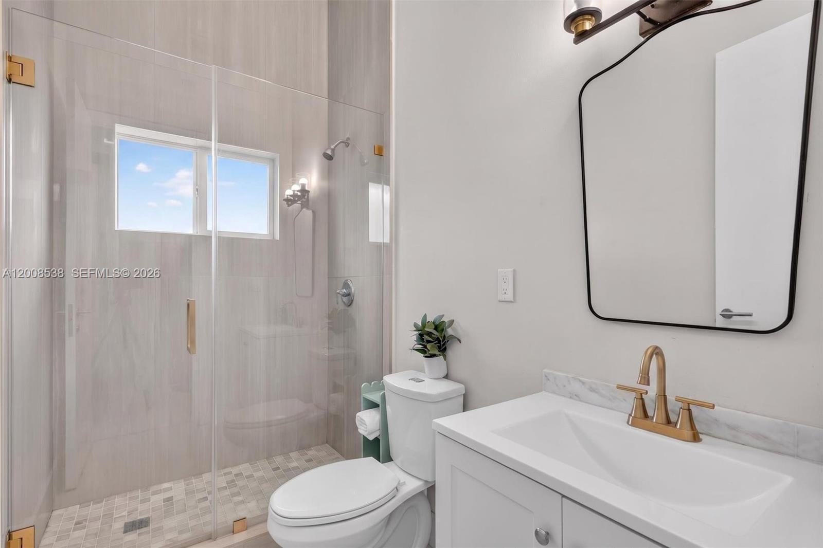 11811 Southwest 82nd Road Miami, FL 33156 - Photo 34 of 63 a bathroom with a sink a toilet and shower