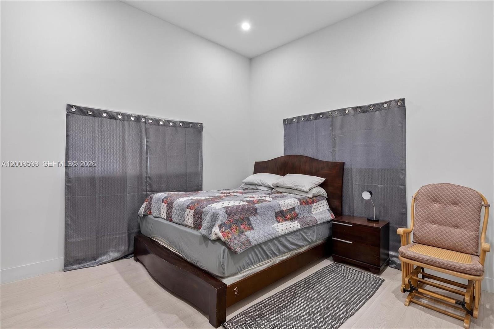 11811 Southwest 82nd Road Miami, FL 33156 - Photo 36 of 63 a bedroom with a bed and a couch