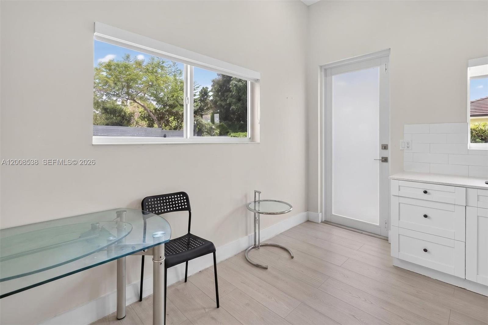 11811 Southwest 82nd Road Miami, FL 33156 - Photo 39 of 63 a view of a chair and table in a room