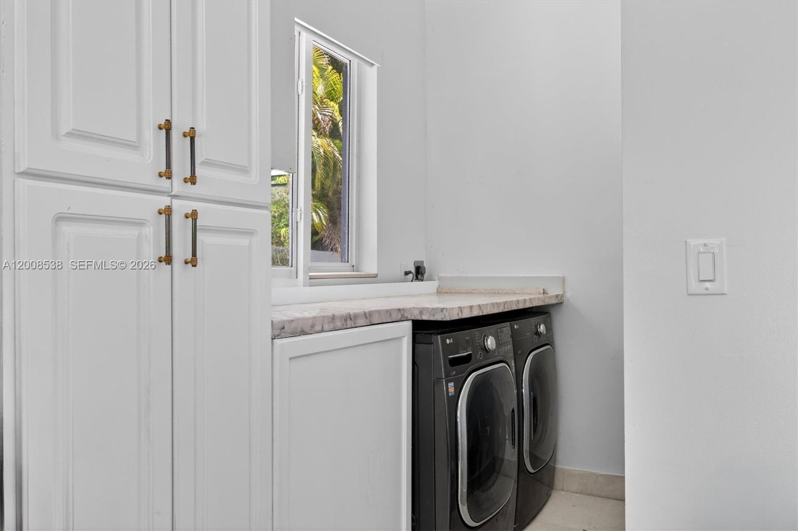 11811 Southwest 82nd Road Miami, FL 33156 - Photo 40 of 63 a utility room with window washer and dryer