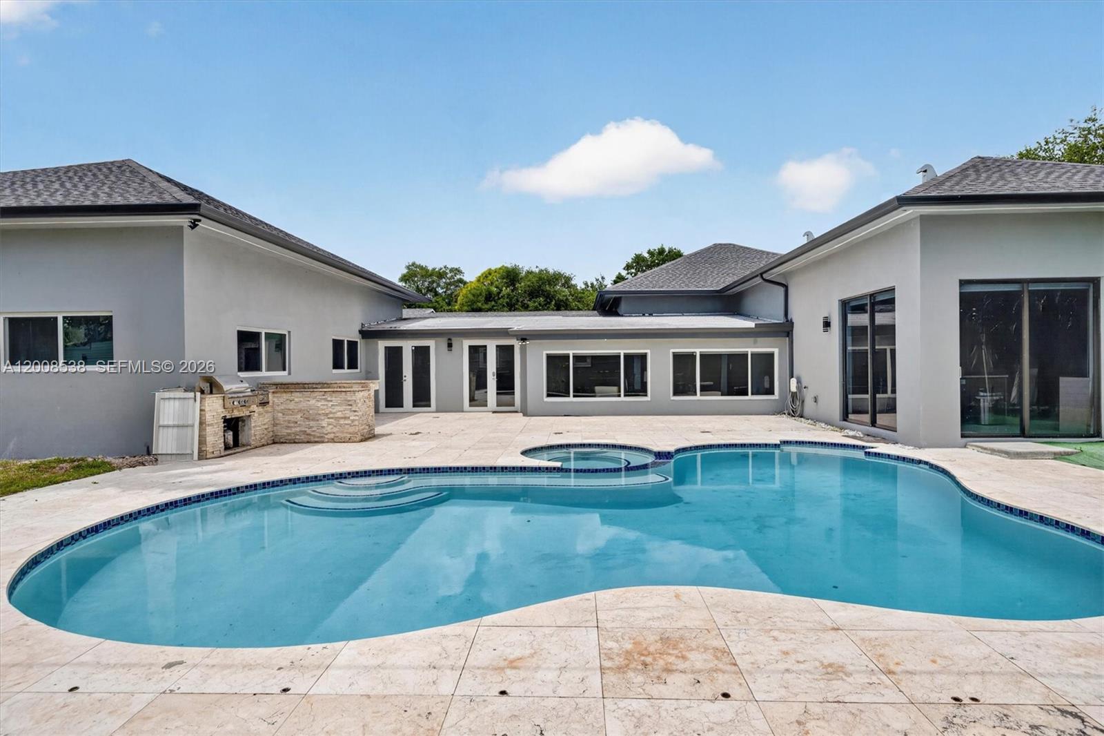 11811 Southwest 82nd Road Miami, FL 33156 - Photo 42 of 63 a view of a house with a swimming pool
