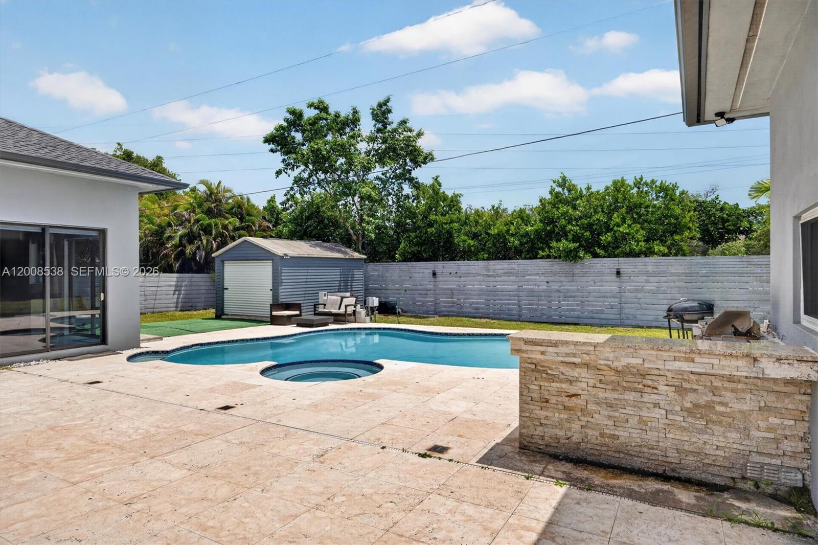 11811 Southwest 82nd Road Miami, FL 33156 - Photo 44 of 63 a view of a backyard with swimming pool