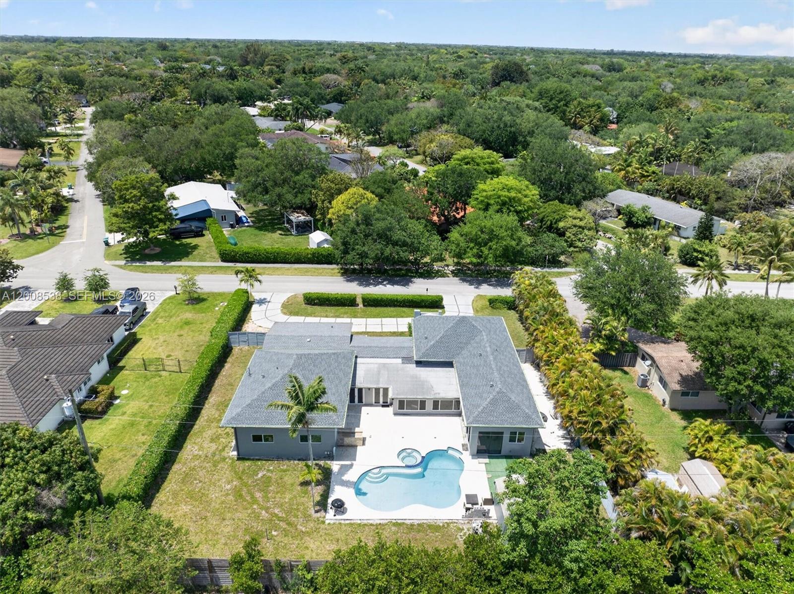 11811 Southwest 82nd Road Miami, FL 33156 - Photo 49 of 63 an aerial view of residential houses with outdoor space and swimming pool