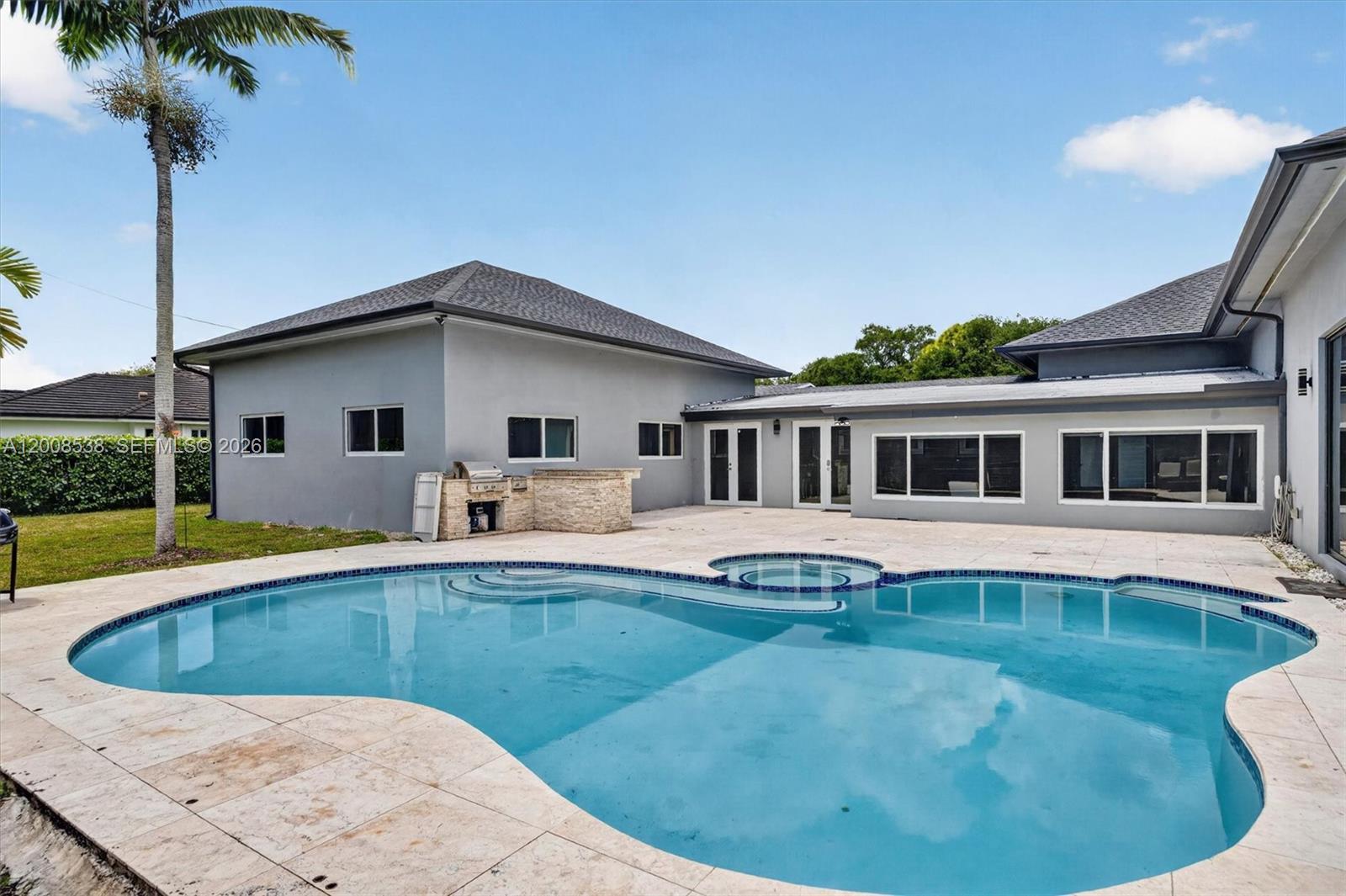 11811 Southwest 82nd Road Miami, FL 33156 - Photo 53 of 63 a view of a house with swimming pool and sitting area