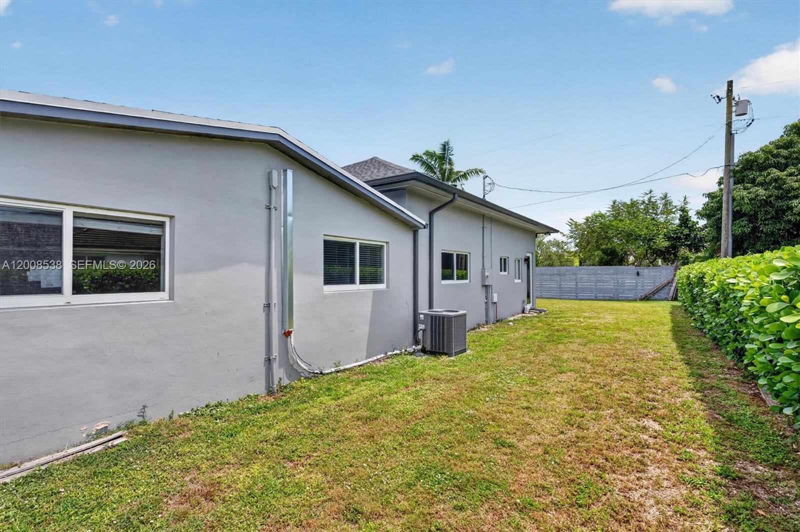 11811 Southwest 82nd Road Miami, FL 33156 - Photo 56 of 63 a view of a house with backyard and plants