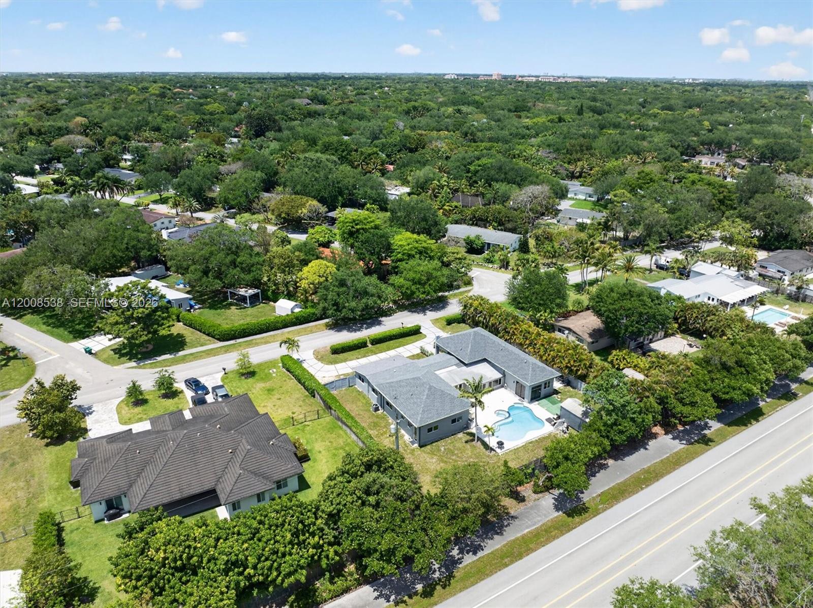 11811 Southwest 82nd Road Miami, FL 33156 - Photo 57 of 63 an aerial view of residential houses with outdoor space and street view